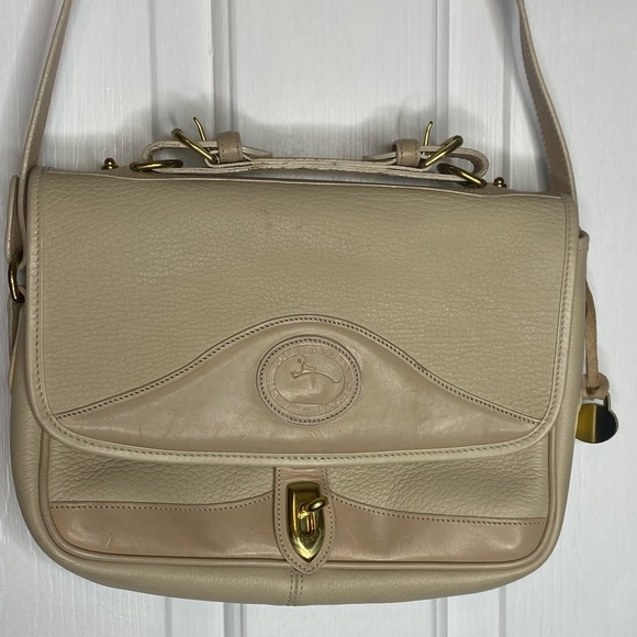 Dooney & Bourke Handbags - Dooney & Bourke Vintage Carrier Bag Purse Crossbody Handle Rare All-white color
